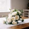 White roses and lisianthus hand tied bridal bouquet